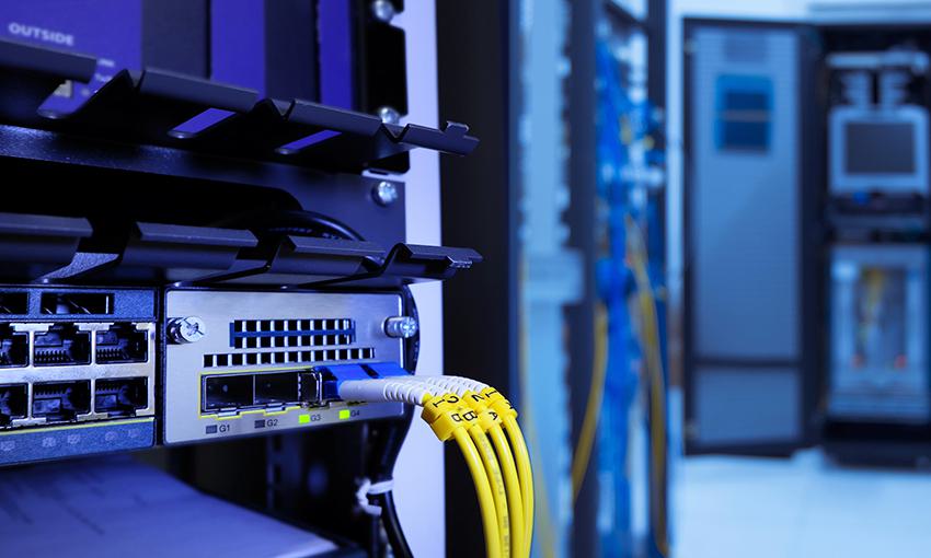close up of switch board with yellow cables