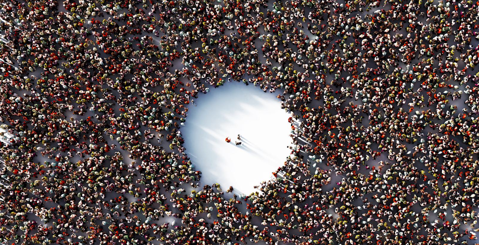 Aerial shot of a crowd with an empty spot in the middle