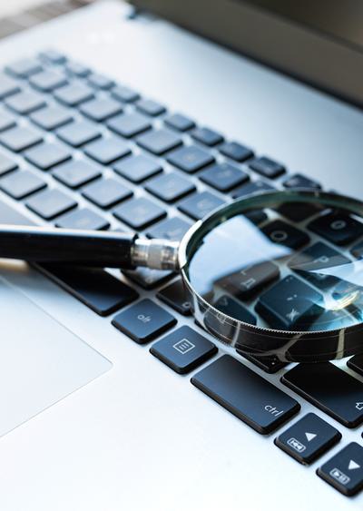 Magnify glass on a keyboard of a macbook
